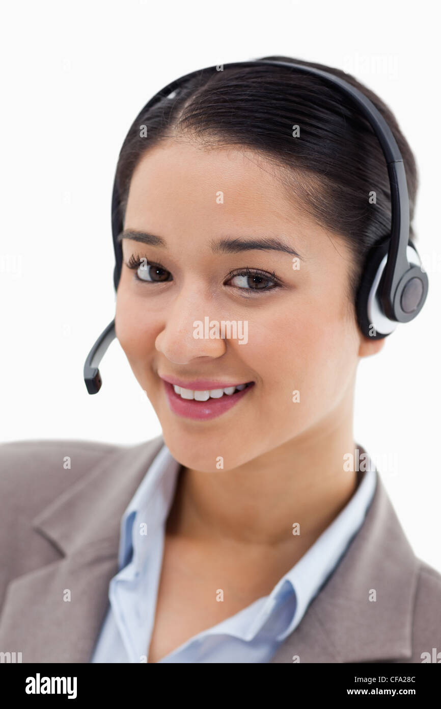 Portrait of a happy office worker posing with a headset Stock Photo