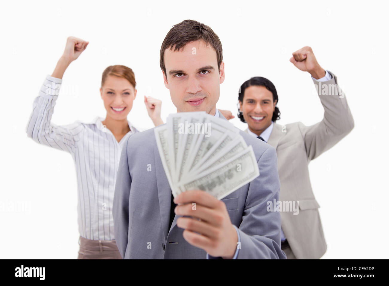 Successful businessman with cheering colleagues Stock Photo