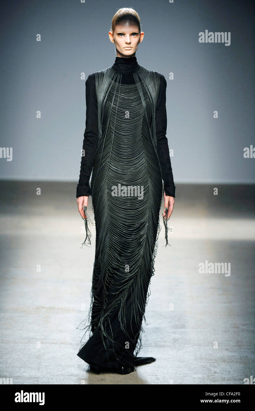 Gareth Pugh Paris Ready to Wear Autumn Winter Black flolength dress with draped beading Stock Photo