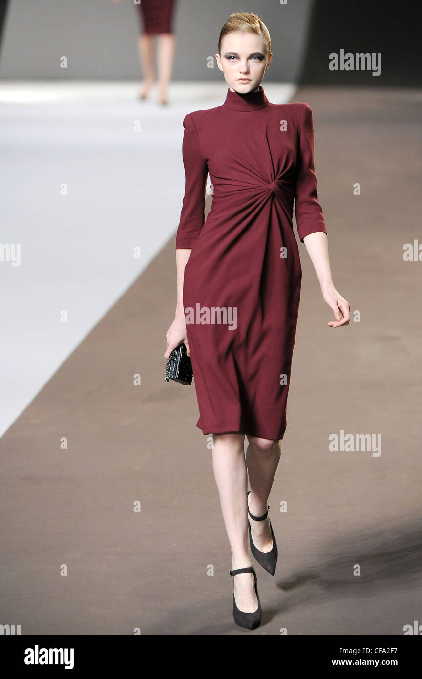 Elie Saab Paris Ready to Wear Autumn Winter Red dress cropped sleeves and  high neck, brown shoes ankle straps, black box clutch Stock Photo - Alamy