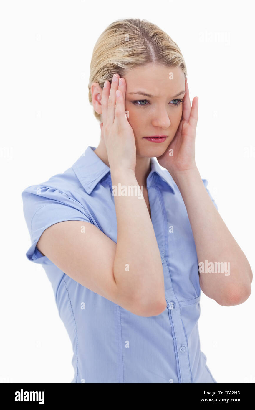 Woman rubbing her temples Stock Photo