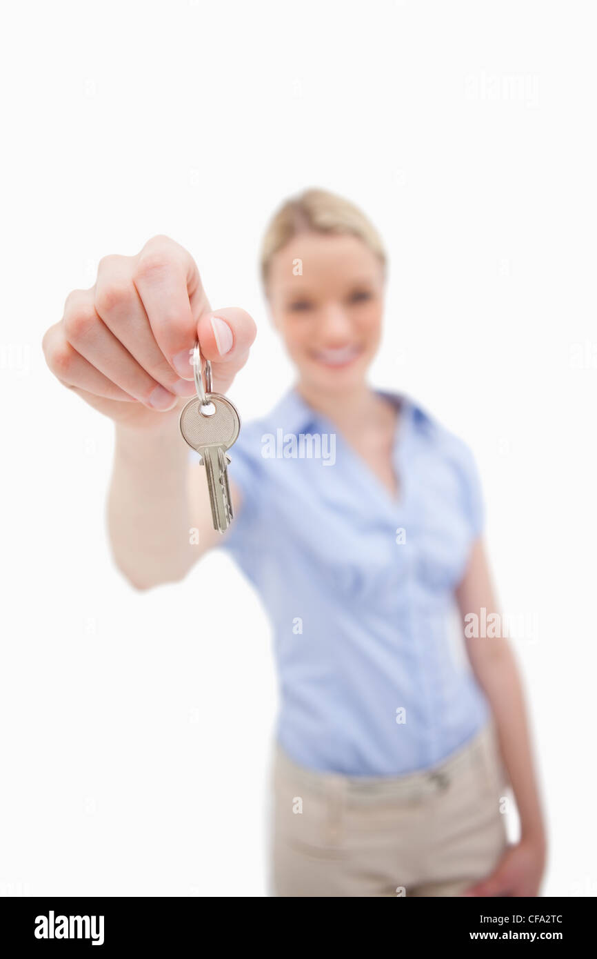 Key being handed over by woman Stock Photo