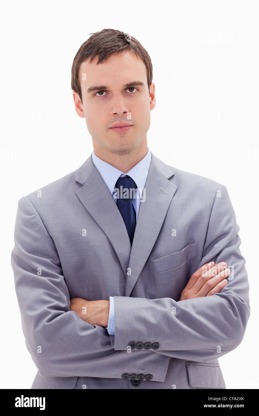 Businessman standing with arms folded Stock Photo