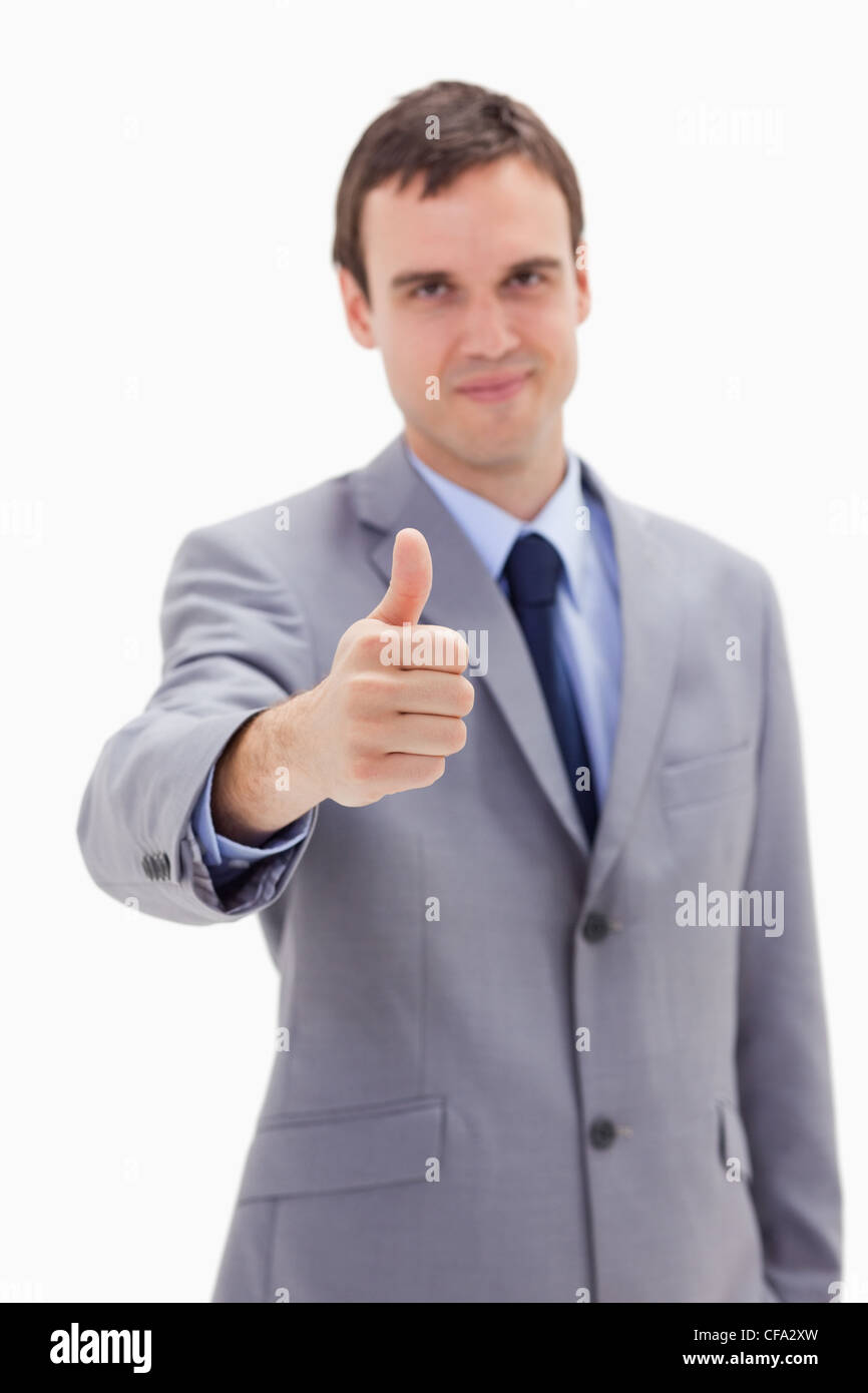 Thumb up given by businessman Stock Photo