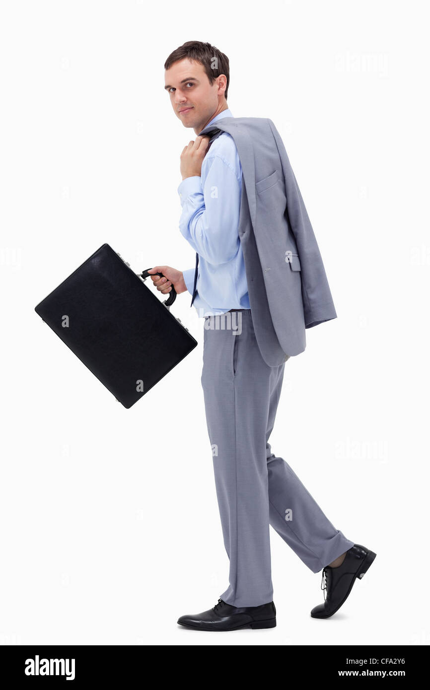 Side view of walking businessman with suitcase Stock Photo