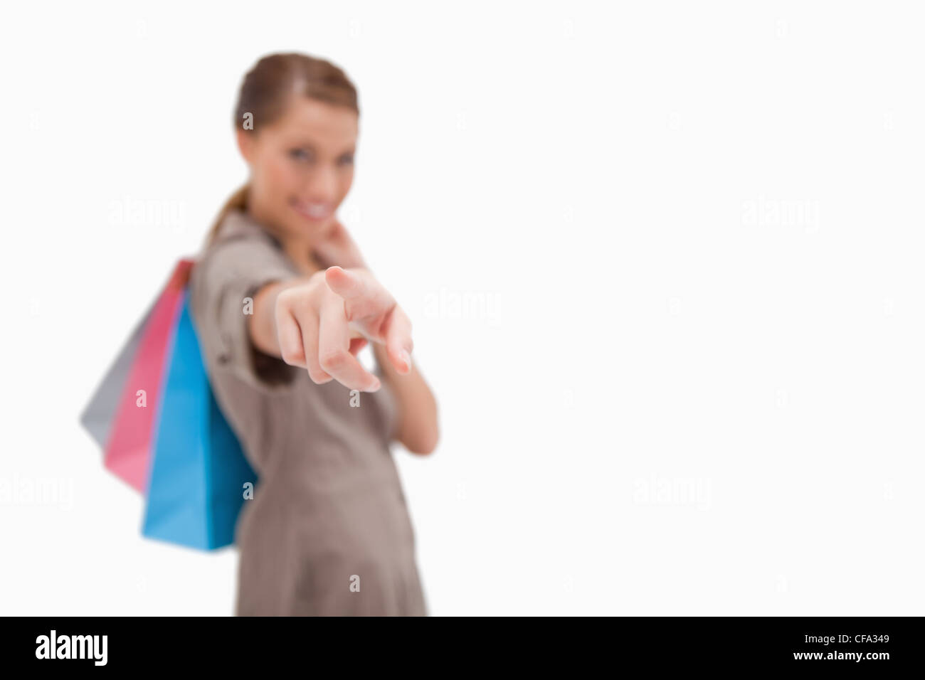 Hand of woman with shopping bags pointing Stock Photo