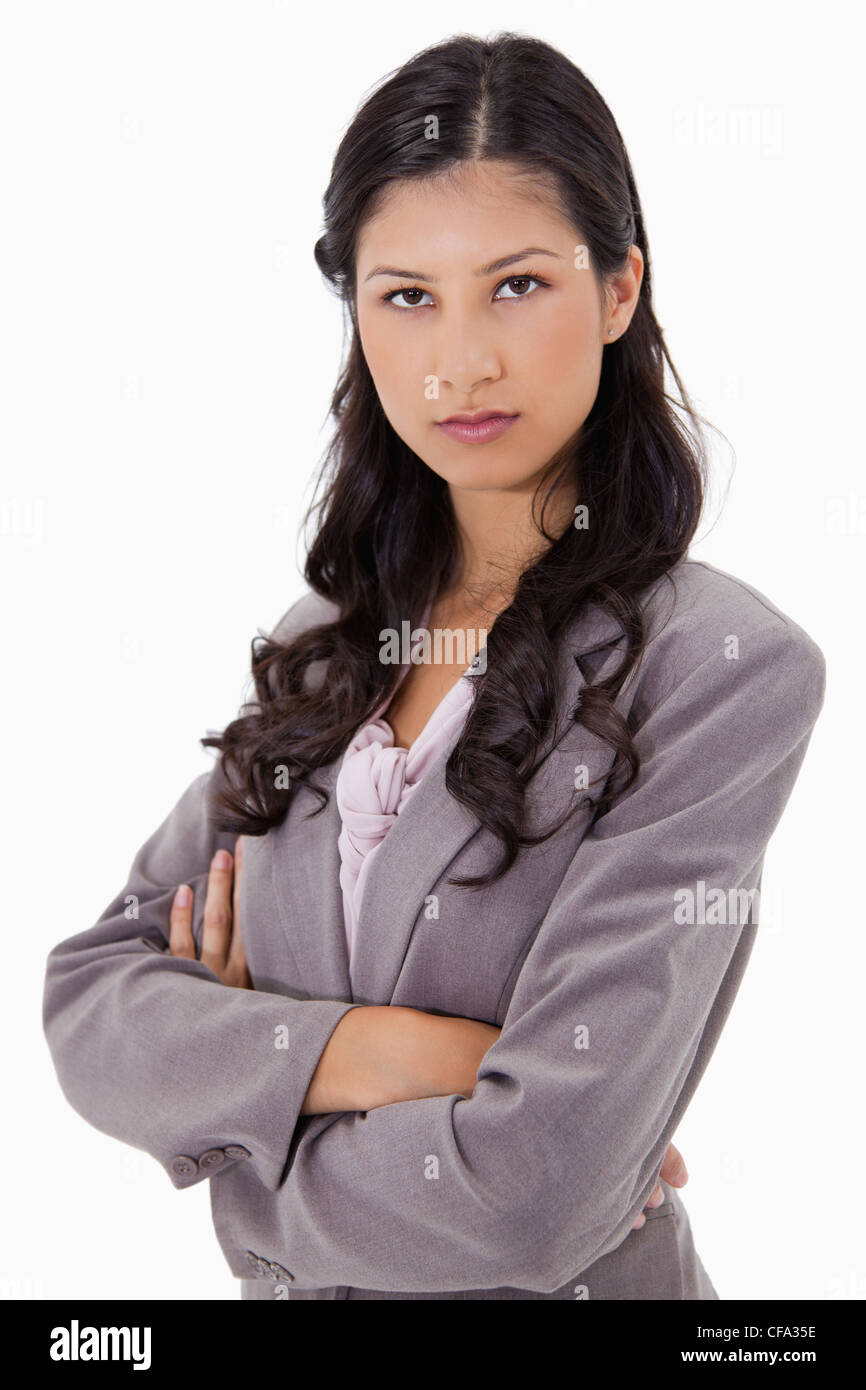 Serious businesswoman with arms folded Stock Photo