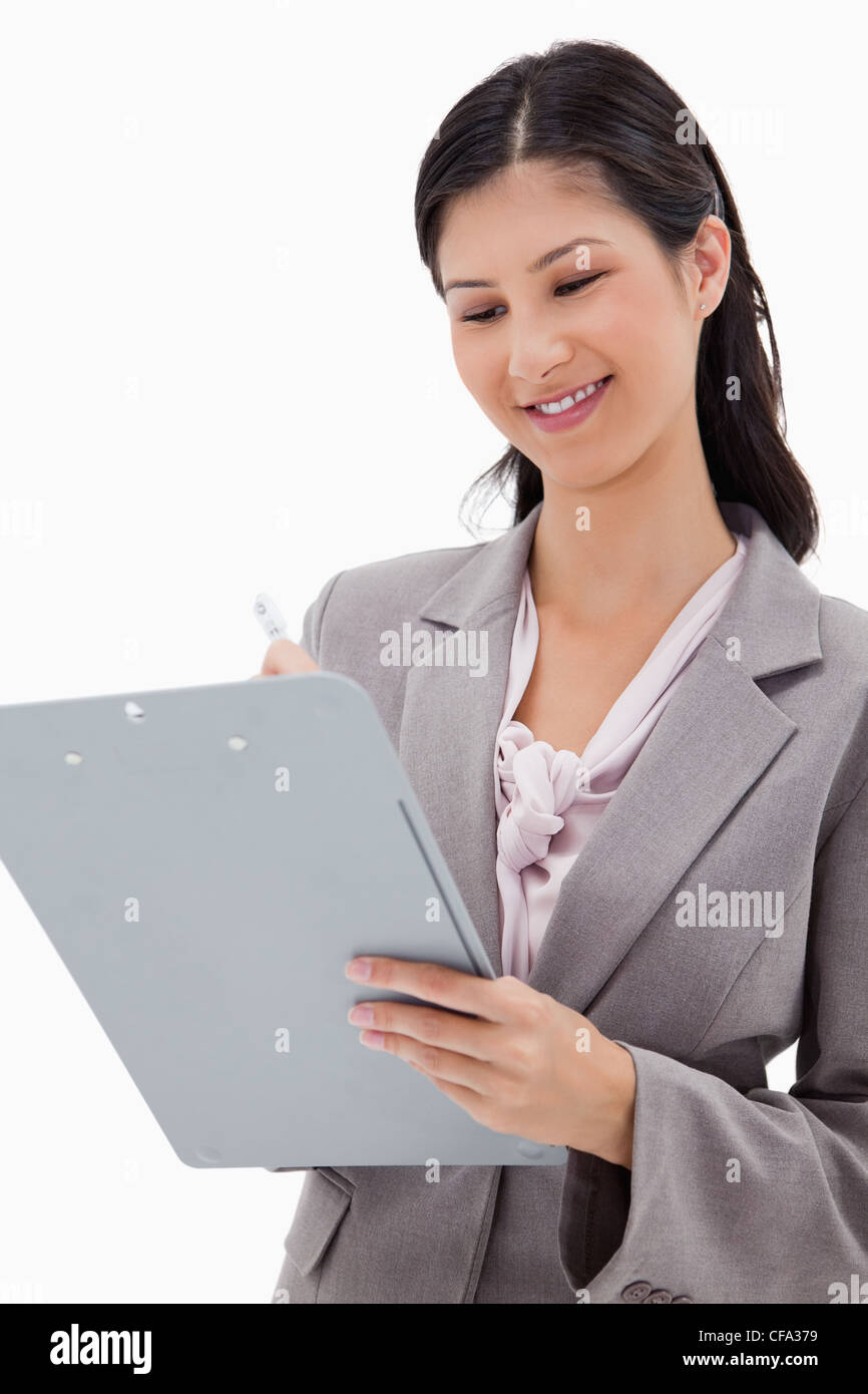 Smiling businesswoman with clipboard Stock Photo