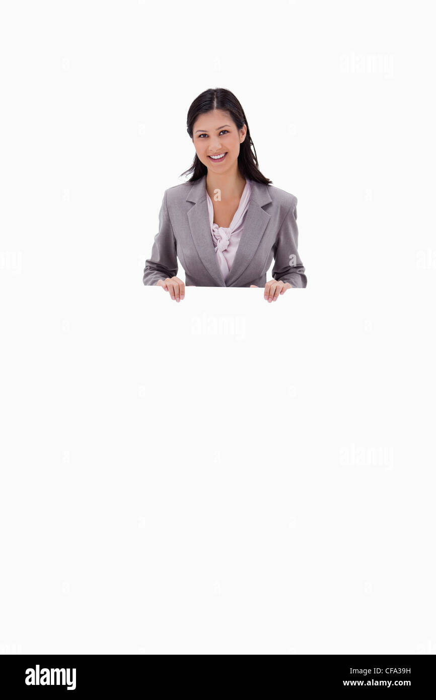 Businesswoman holding blank sign board Stock Photo
