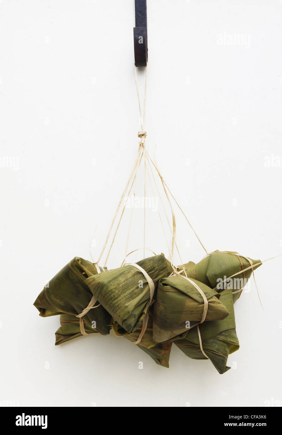 a bundle of chinese rice dumplings, a traditional food for 'dragon boat festival'. Stock Photo