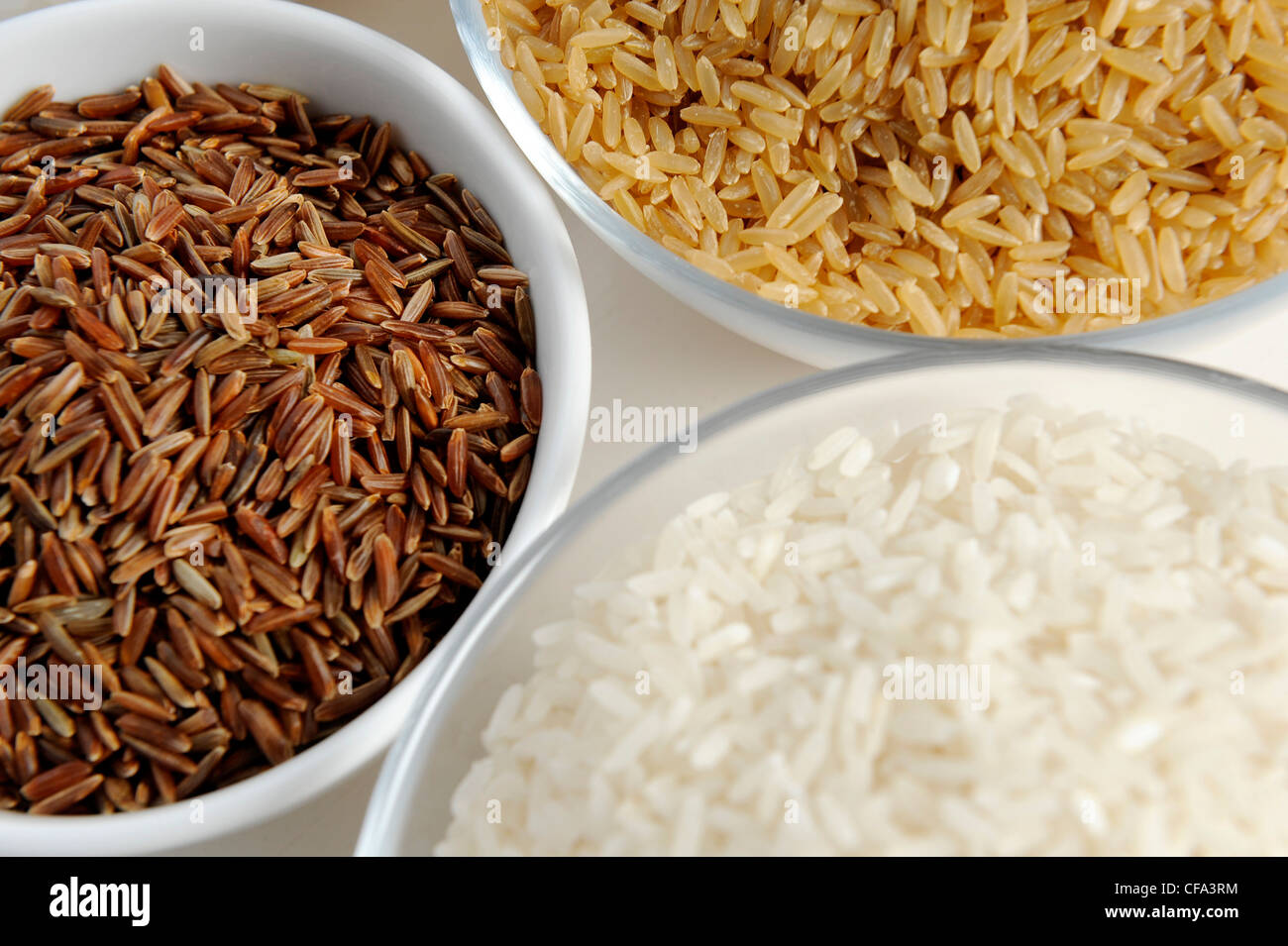 Three bowls of different varieties of rice Stock Photo - Alamy