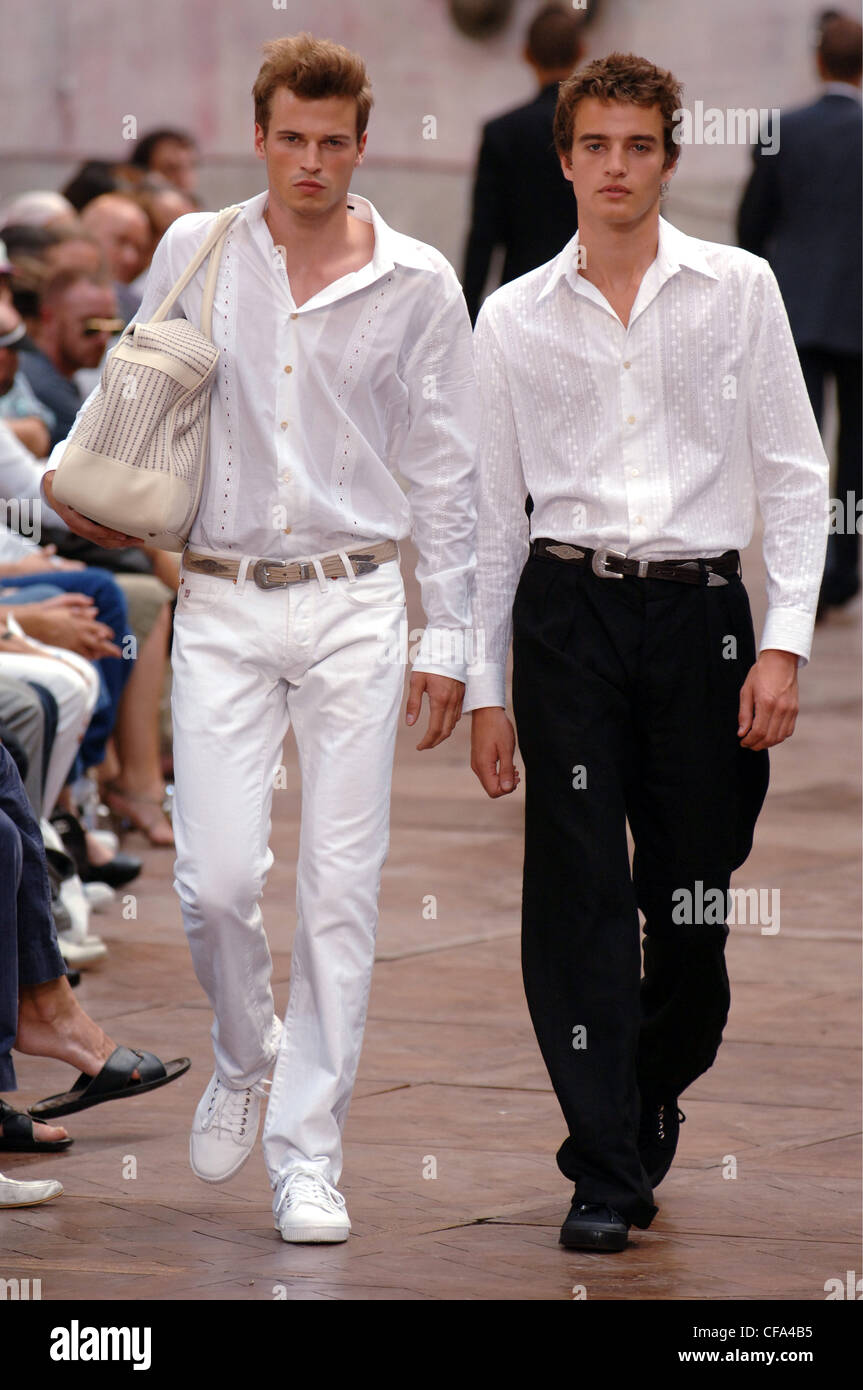 Paul Smith Paris Ready to Wear Menswear Spring Summer Two brunette male  models short hair one wearing a white shirt white Stock Photo - Alamy