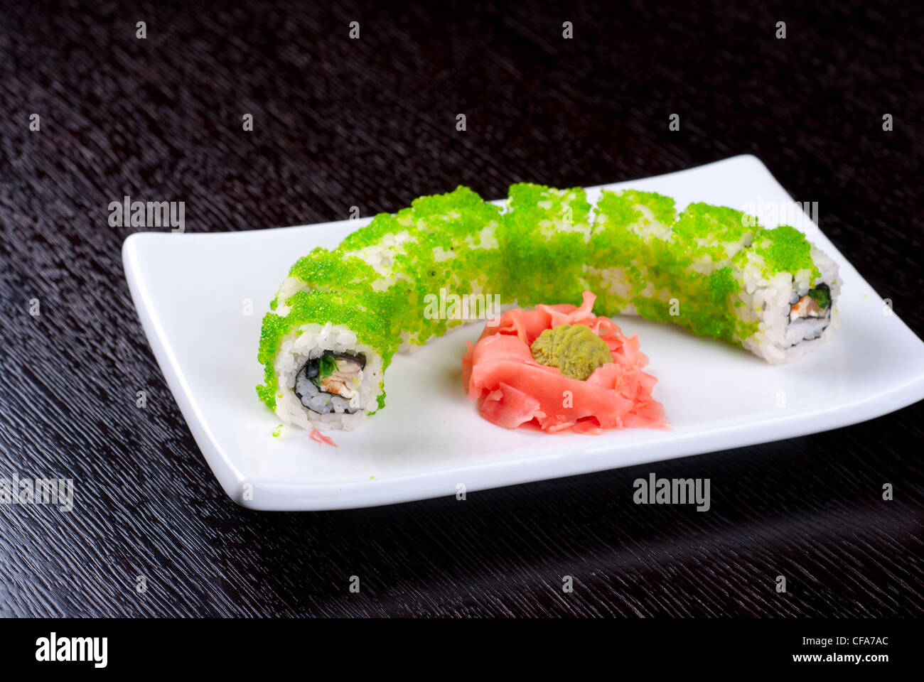 Sushi rolls made of salmon, avocado, flying fish roe - tobiko caviar ...