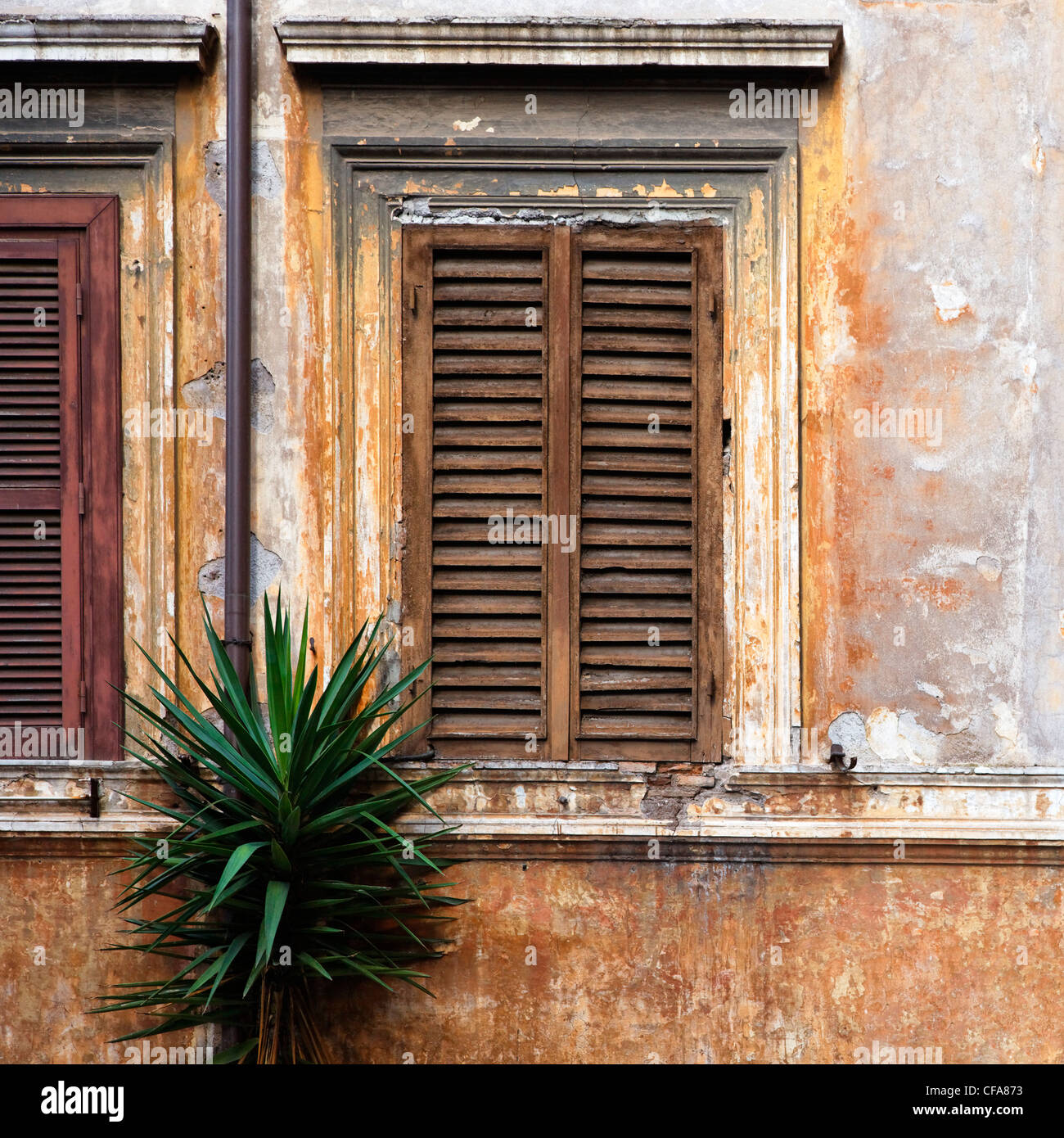 Shuttered window in stone wall Stock Photo - Alamy