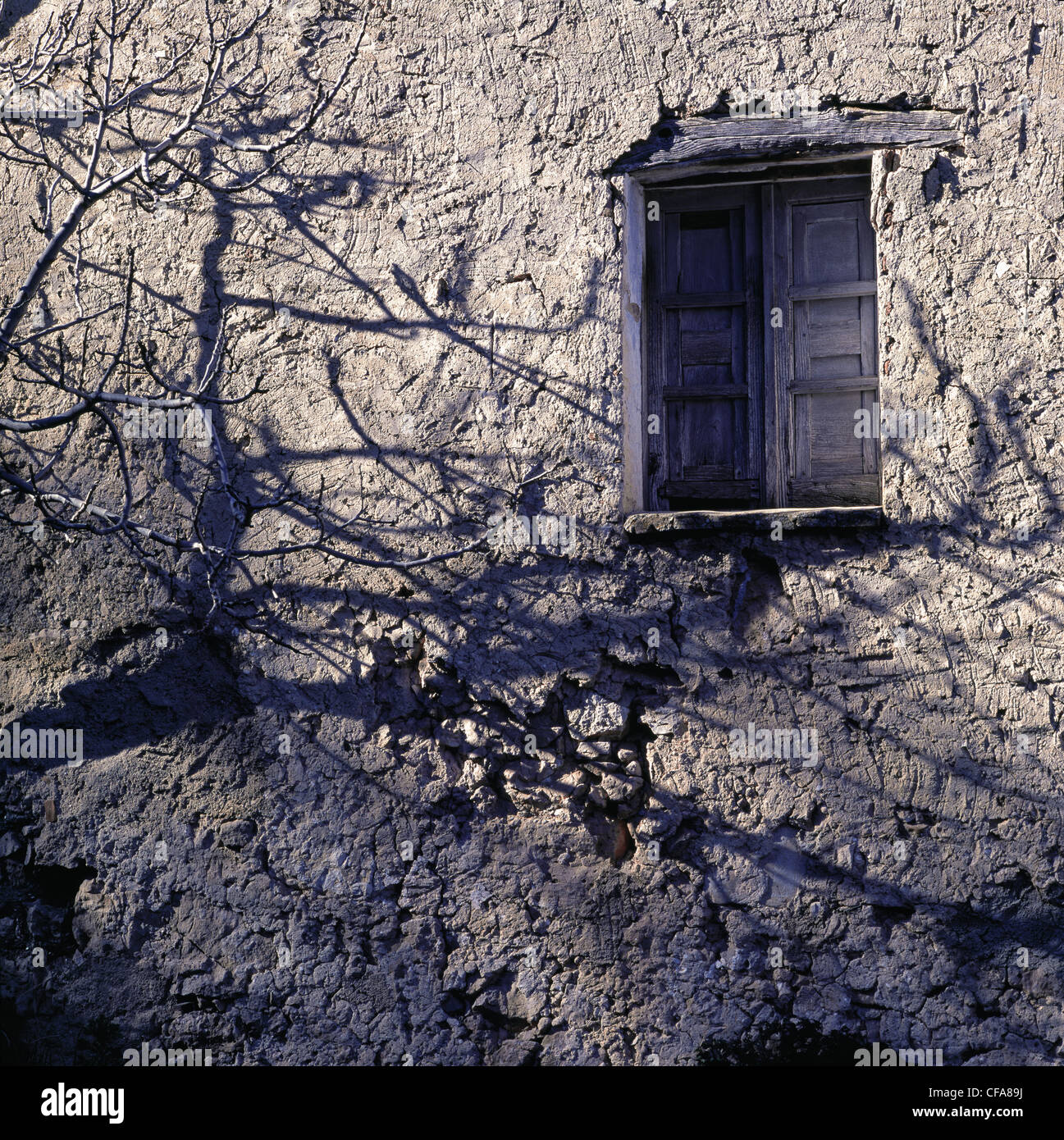 Shuttered window in stone wall Stock Photo - Alamy
