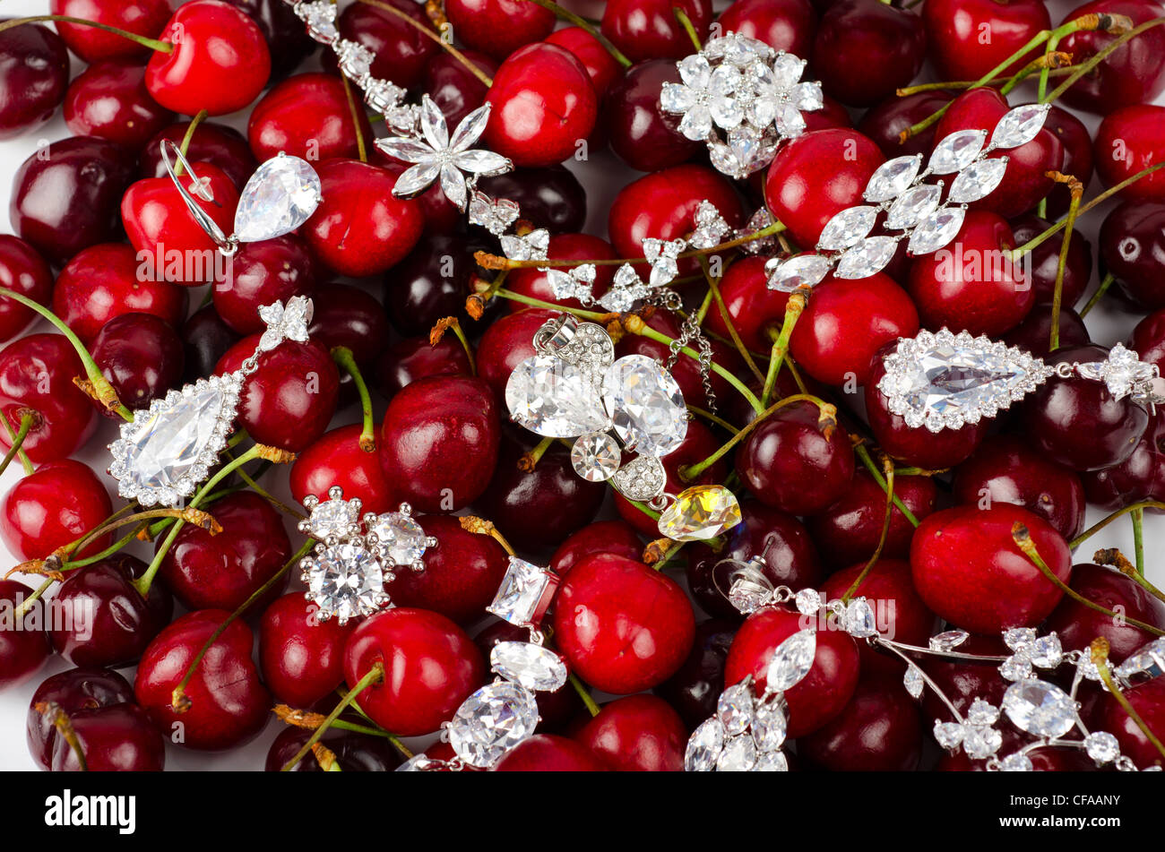 Jewels at fruit red ripe cherries berry background Stock Photo Alamy