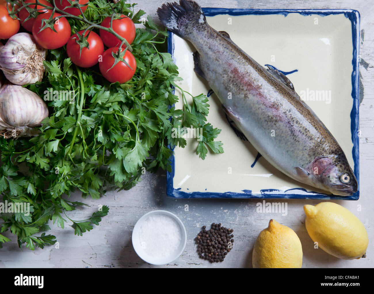 Rainbow trout with spices and vegetables Stock Photo - Alamy