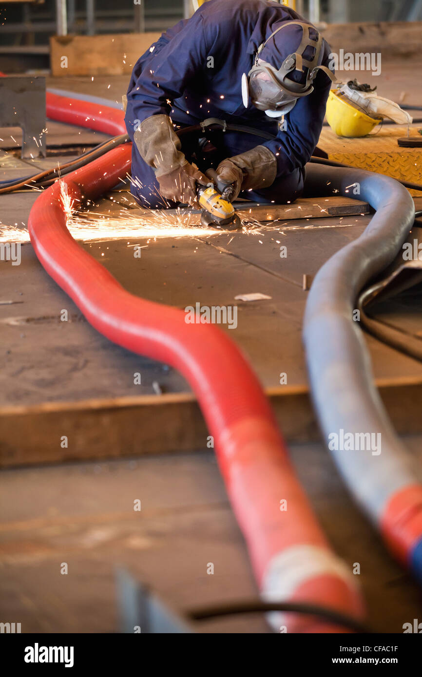 Steel cutter at work in shipyard Stock Photo Alamy