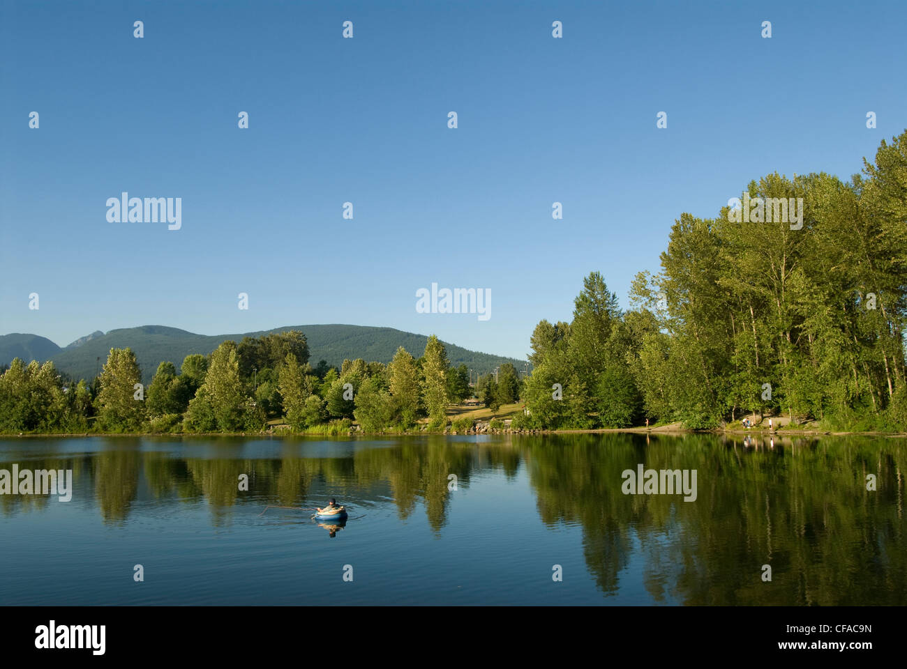 Fly fishing on Lafarge Lake, Coquitlam, British Columbia, Canada Stock