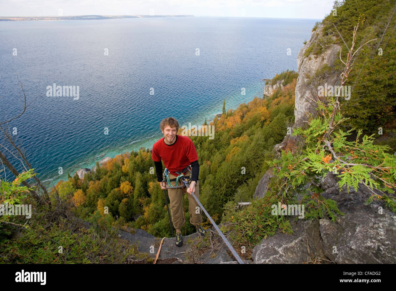 A rock climber repels down the Niagara Escarpment cliff face at Lion's
