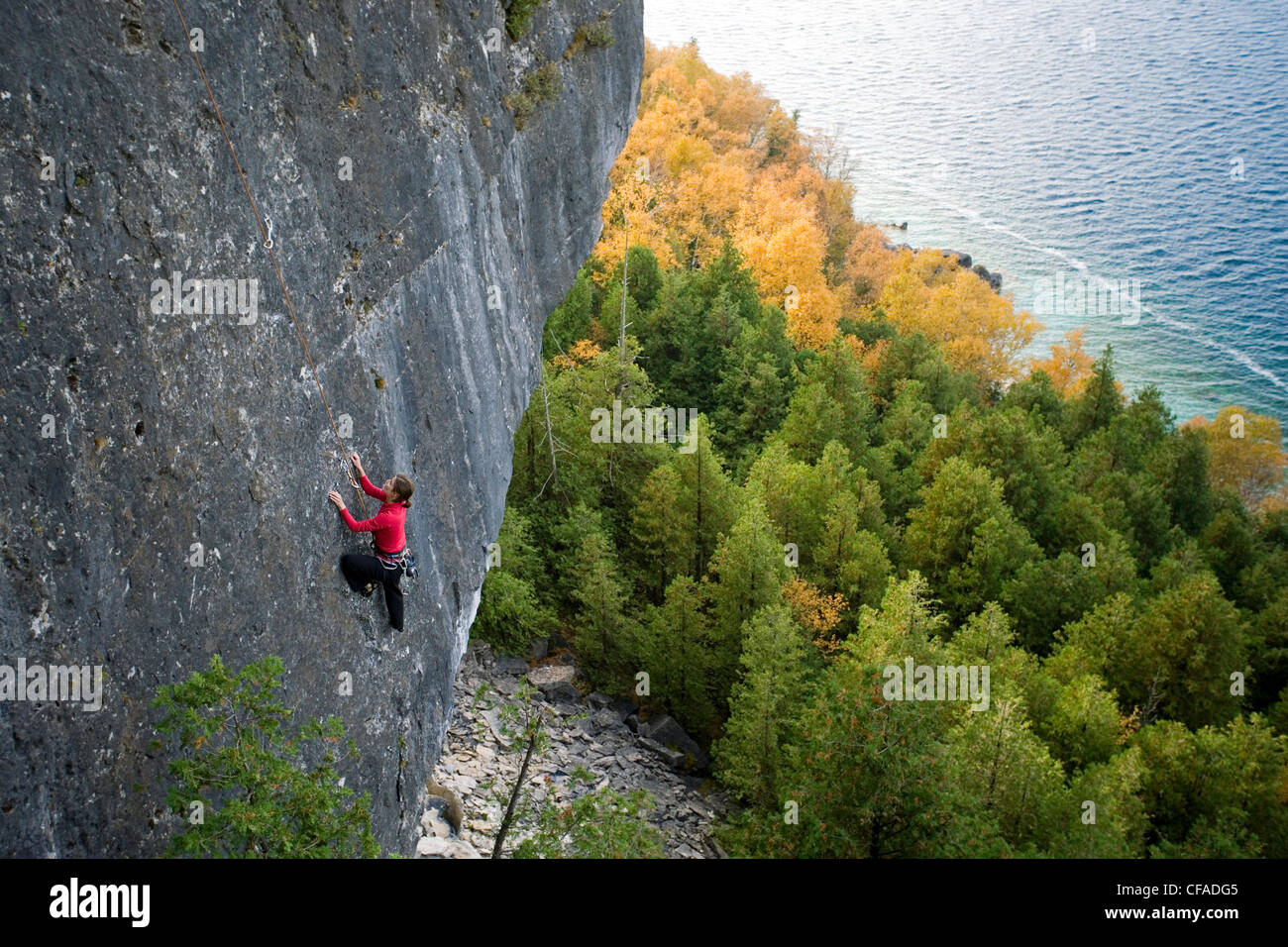 A rock climber repels down the Niagara Escarpment cliff face at Lion's