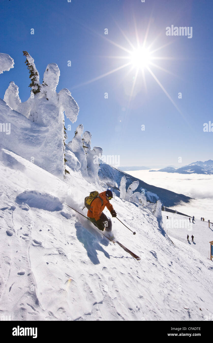 Young man telemarkskiing at Revelstoke Mountain Resort, BC, Canada