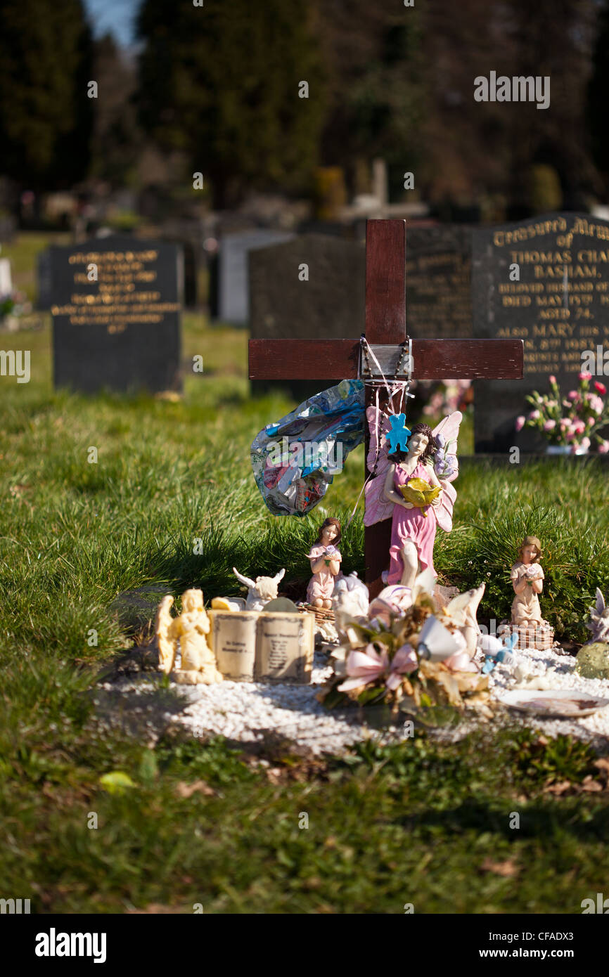 grave decorated with angels and religious symbols Stock Photo