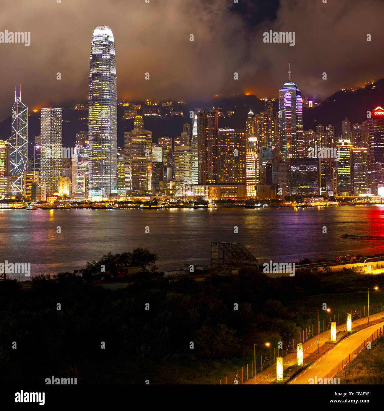 Elevated view across the busy Hong Kong harbour, Central district of Hong Kong Island and Victoria Peak, Hong Kong, China Stock Photo