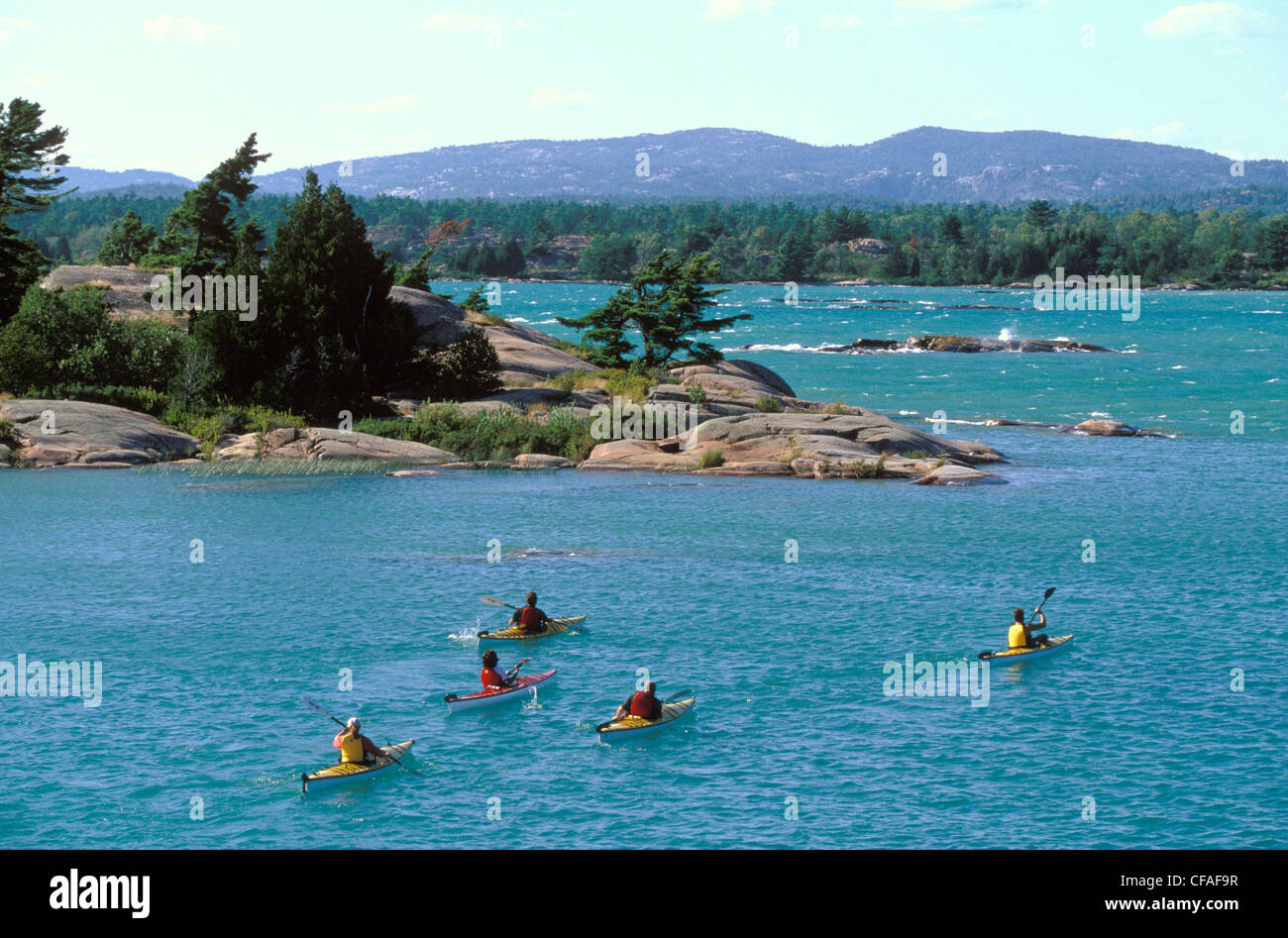 Group of young adults sea kayak in Bay near Killarney, Ontario, Canada Stock Photo Alamy