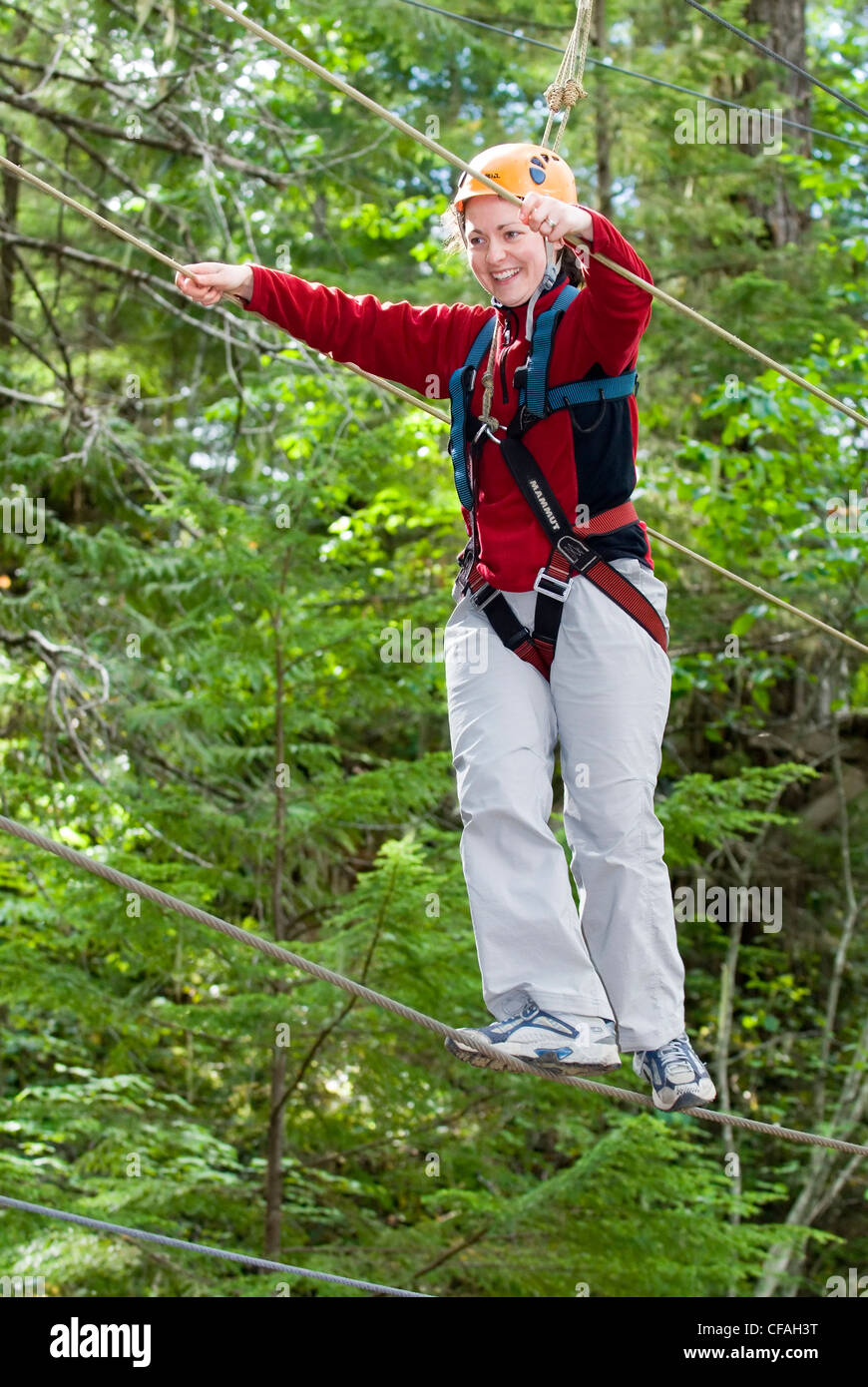 woman having fun High-Ropes course StrathconPark Stock Photo
