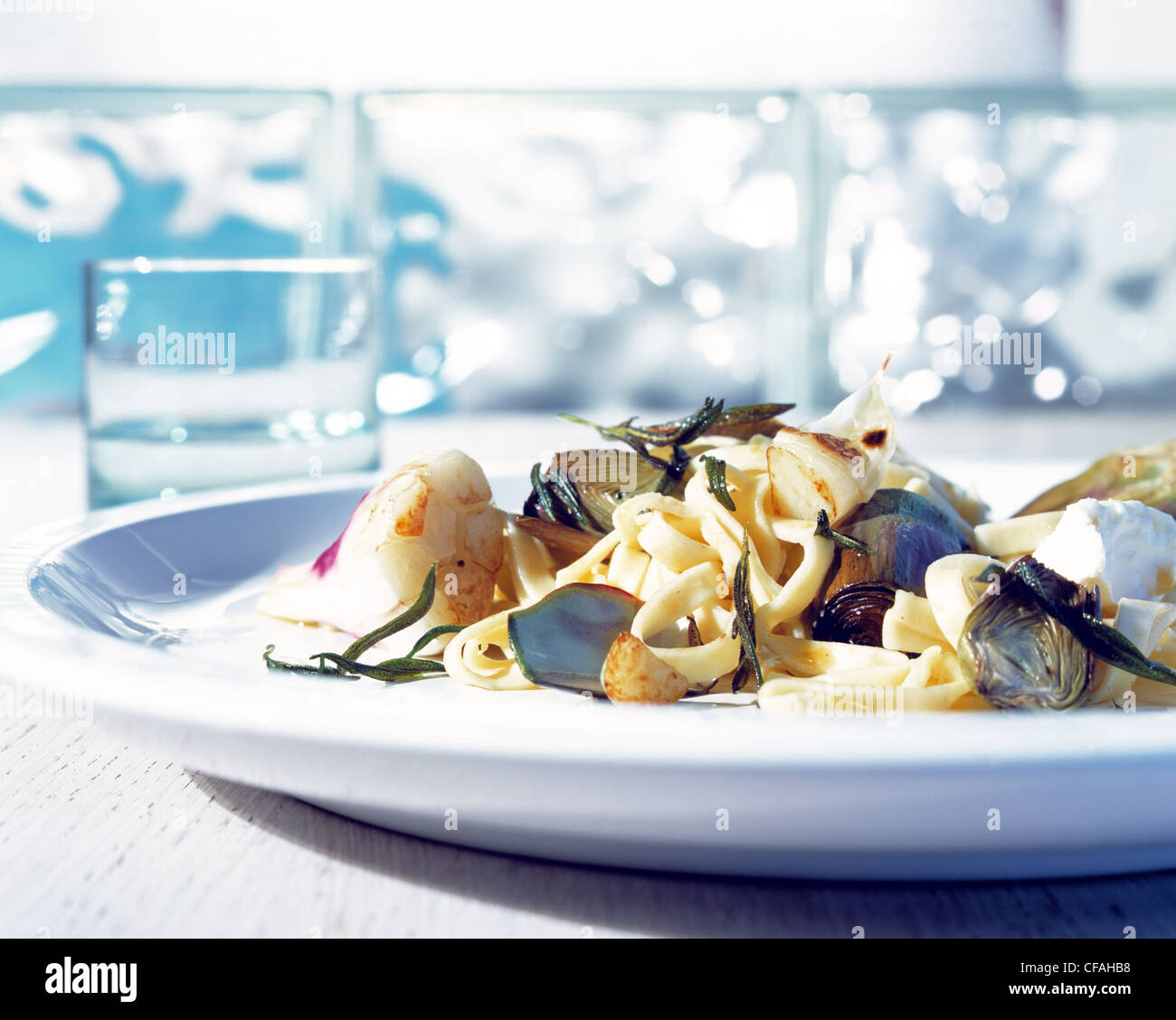 Ribbon noodles with artichokes Stock Photo Alamy