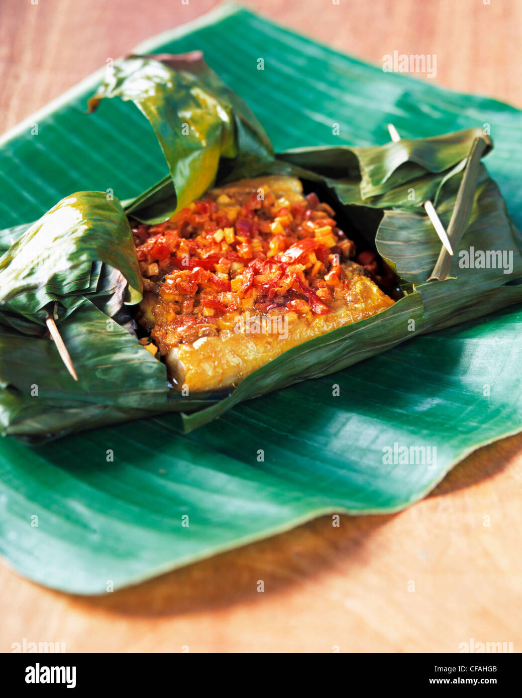 Fish wrapped with banana leaf Ghana Stock Photo Alamy