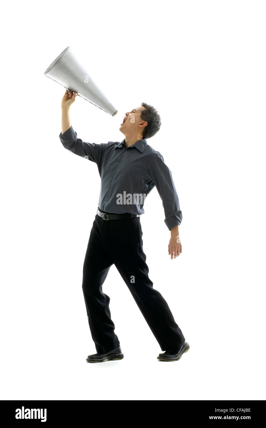 43 year old asian man shouting through a megaphone, Montreal, Quebec, Canada. Stock Photo