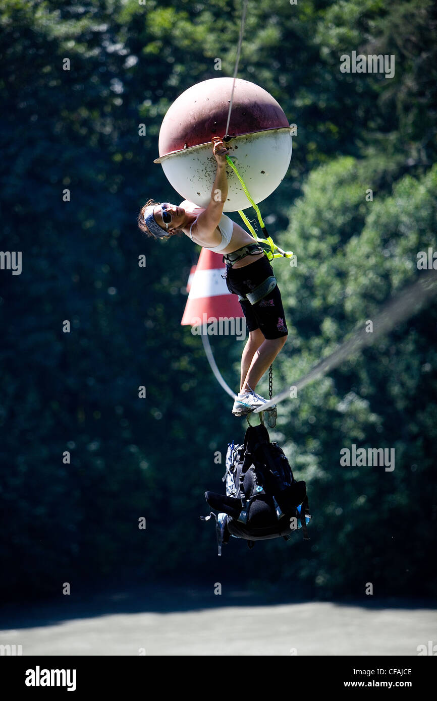 Woman Crossing Rope Woman crossing a rope bridge hi-res stock photography and images - Alamy