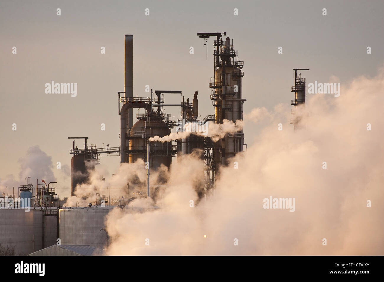 Oil refinery and clouds of steam, Edmonton, Alberta, Canada Stock Photo