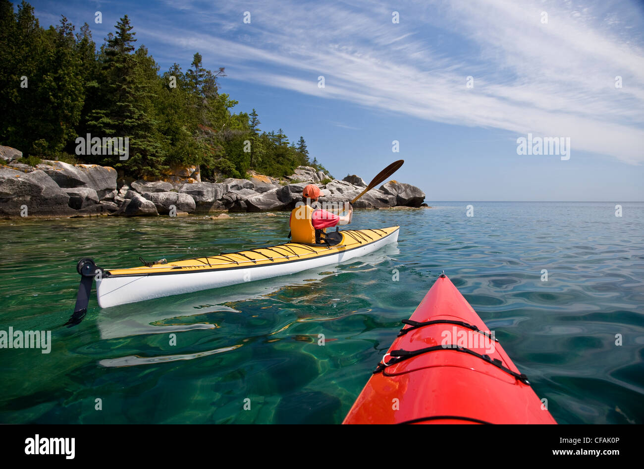 Kayaking in Bay along Niagara Escarpment near Tobermory, Bruce Penninsula, Ontario