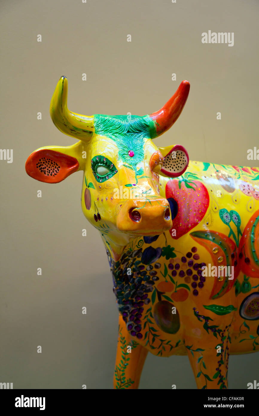 Brightly painted fiberglass figure of Rita the cow in Weston park