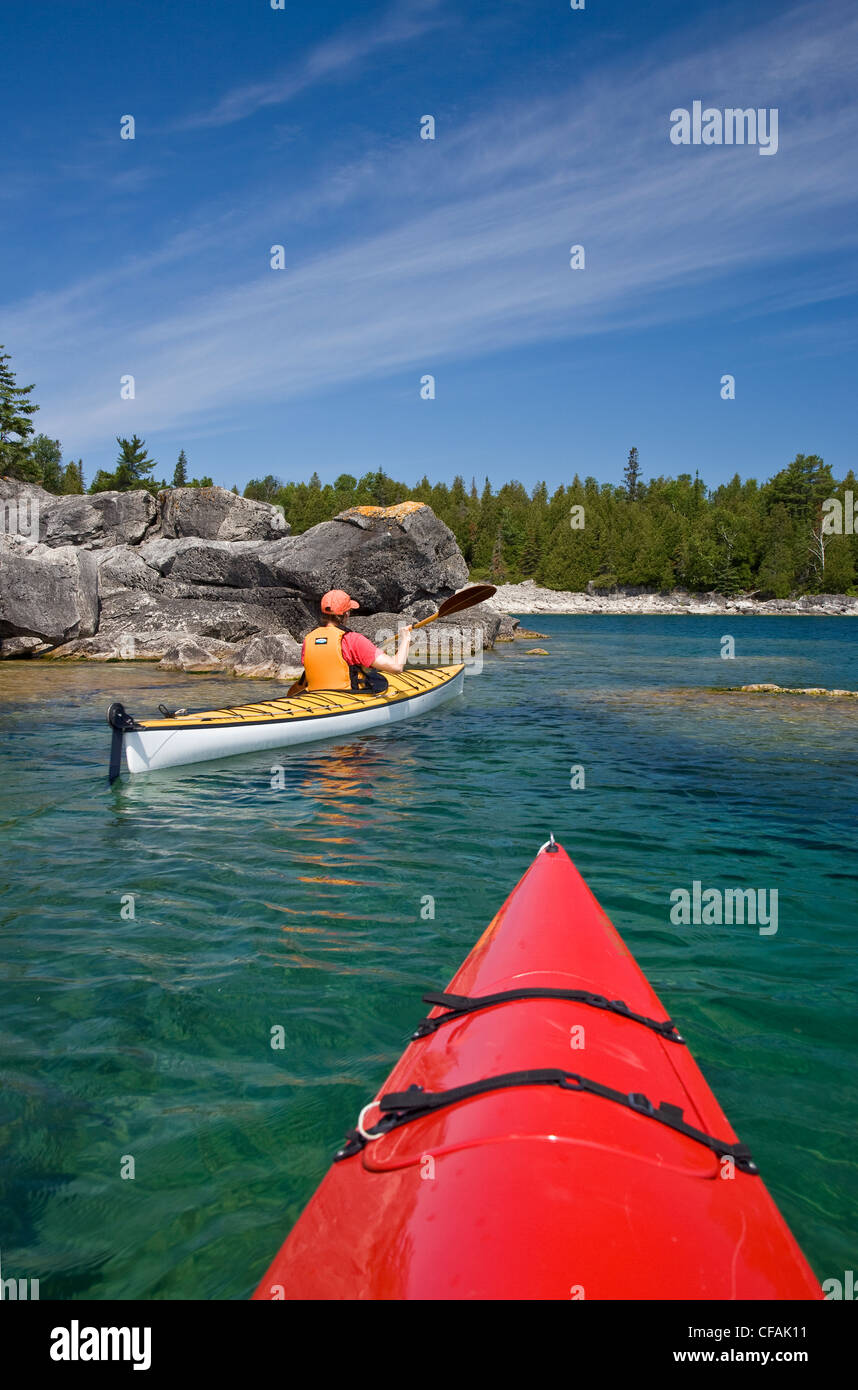 Kayaking in Bay along Niagara Escarpment near Tobermory, Bruce
