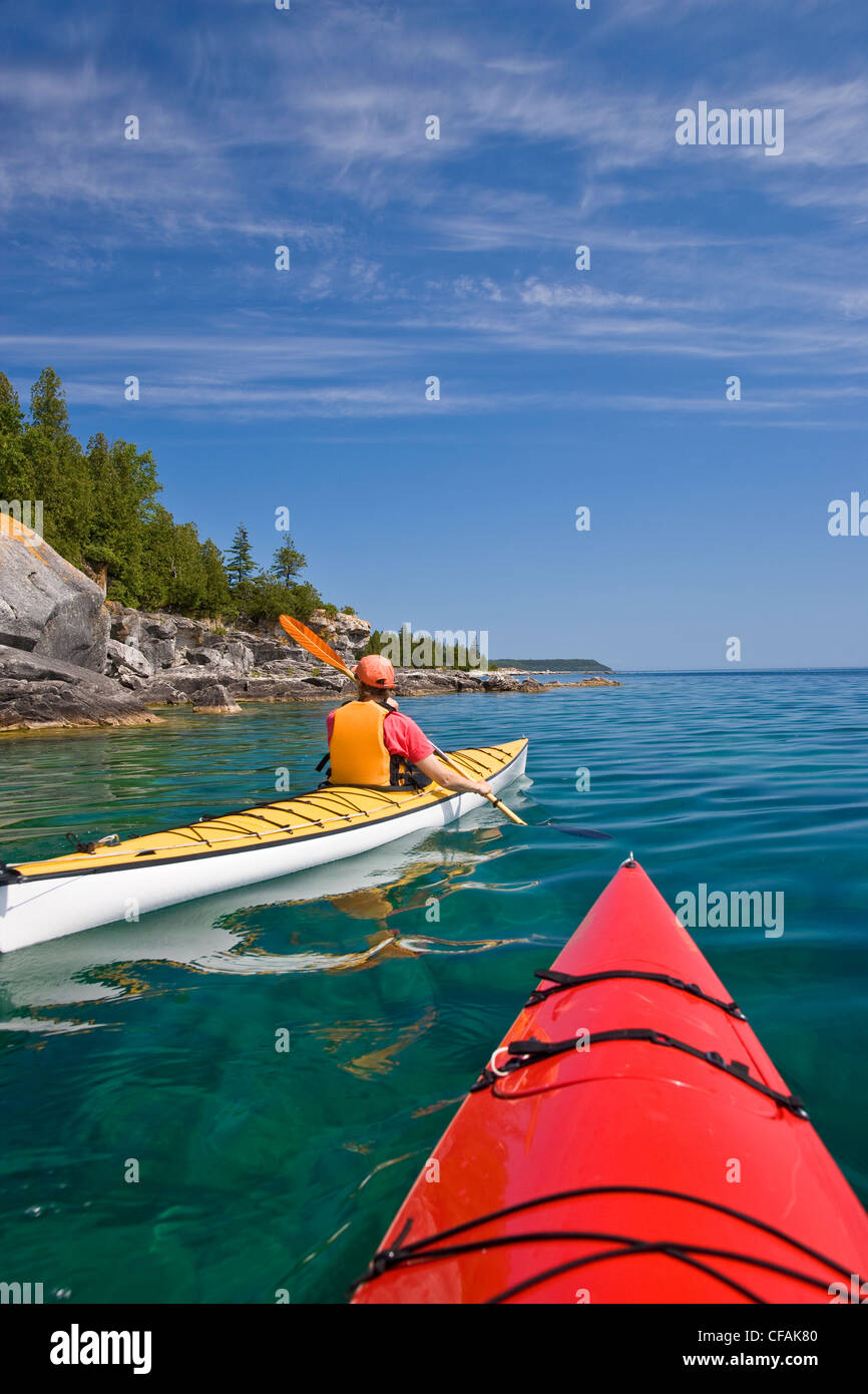 Kayaking in Bay along Niagara Escarpment near Tobermory, Bruce