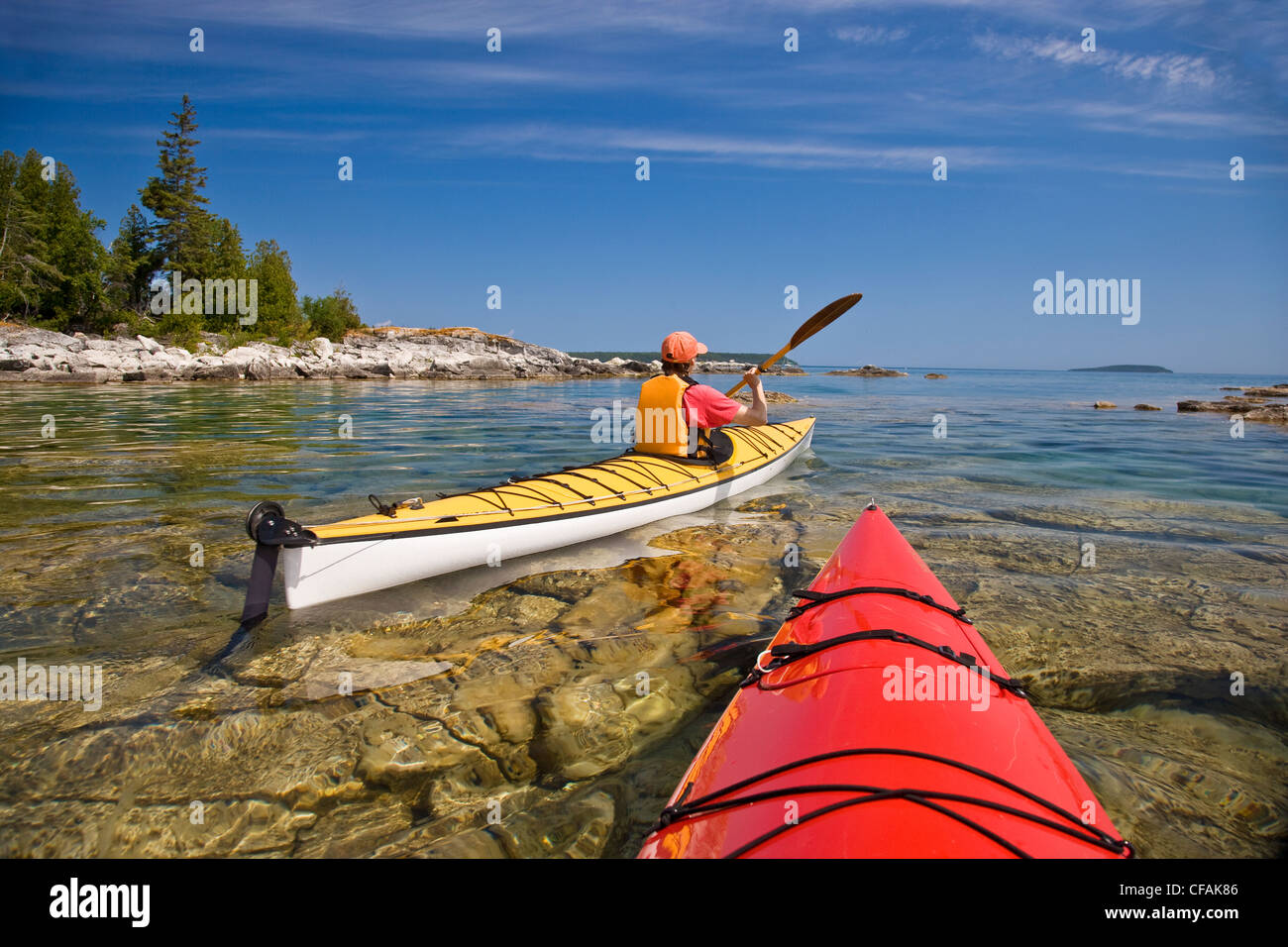 Kayaking in Bay along Niagara Escarpment near Tobermory, Bruce