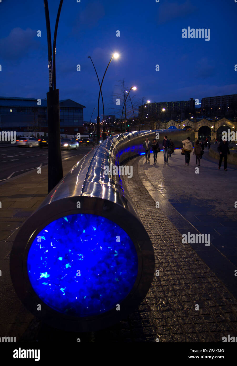 Sheffield train station at night with illuminated fountains and water