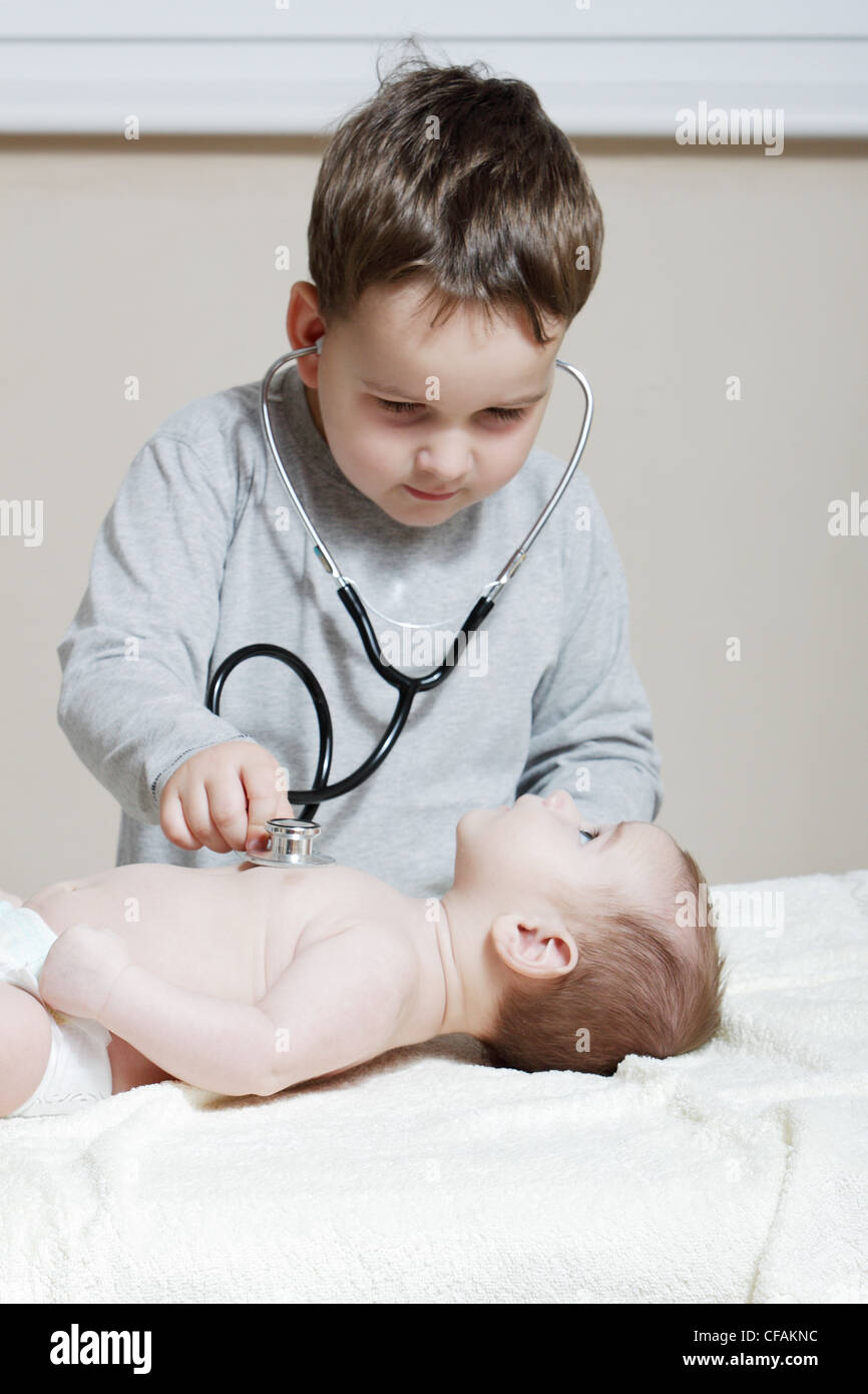 Stethoscope listening to a baby's heartbeat Stock Photo - Alamy