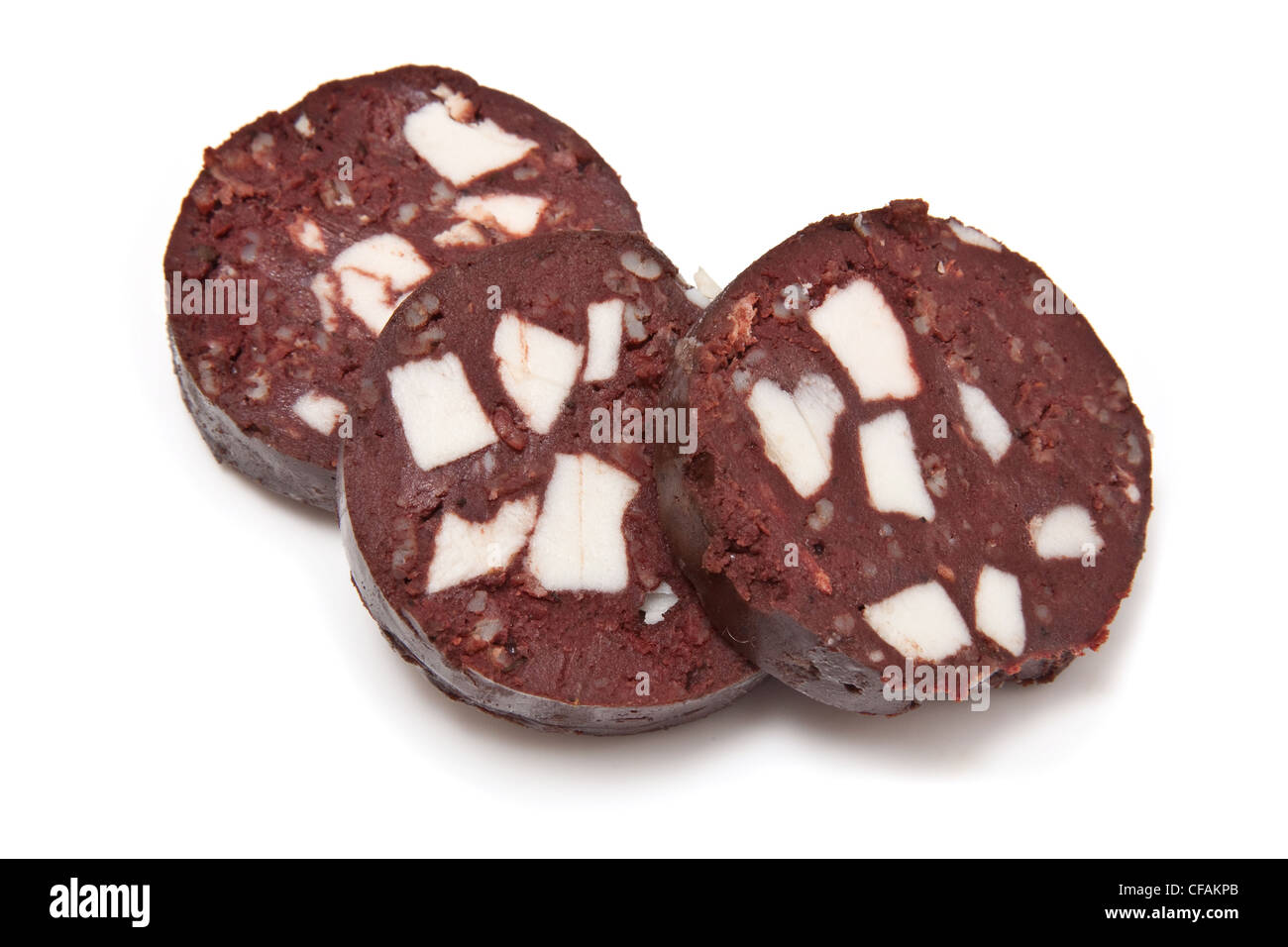 Black pudding or blood sausage sliced and uncooked on a white studio