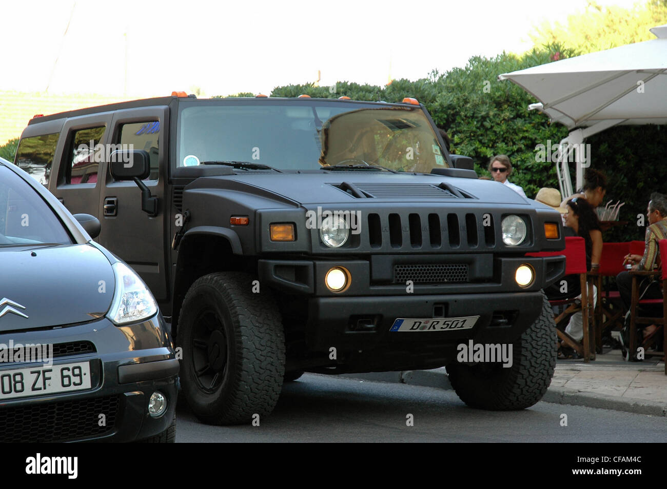 Matt black Hummer 4x4 driving through the streets of St Tropez, South of  France Stock Photo - Alamy