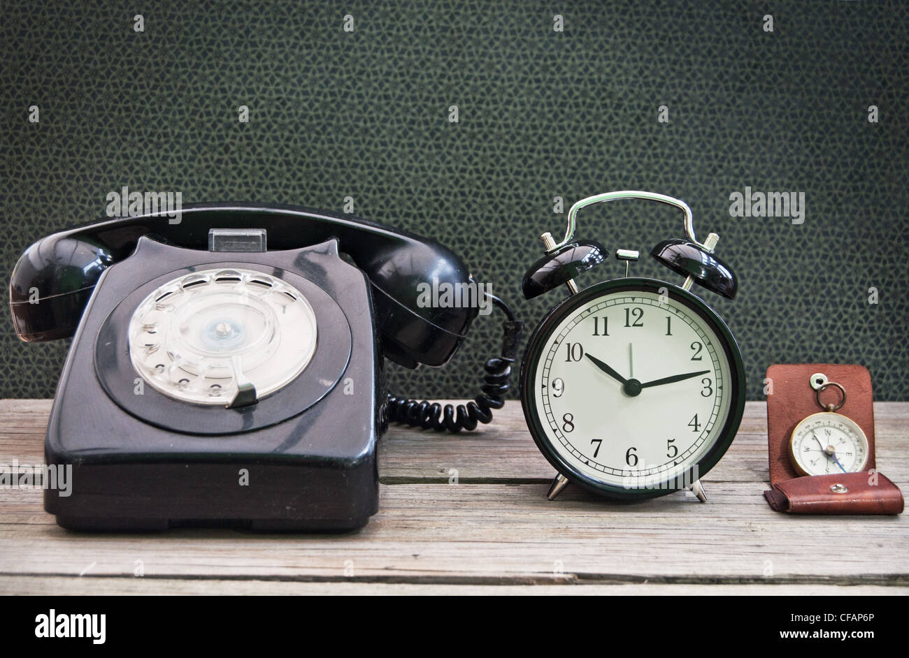 Old telephone, clock and compass Stock Photo