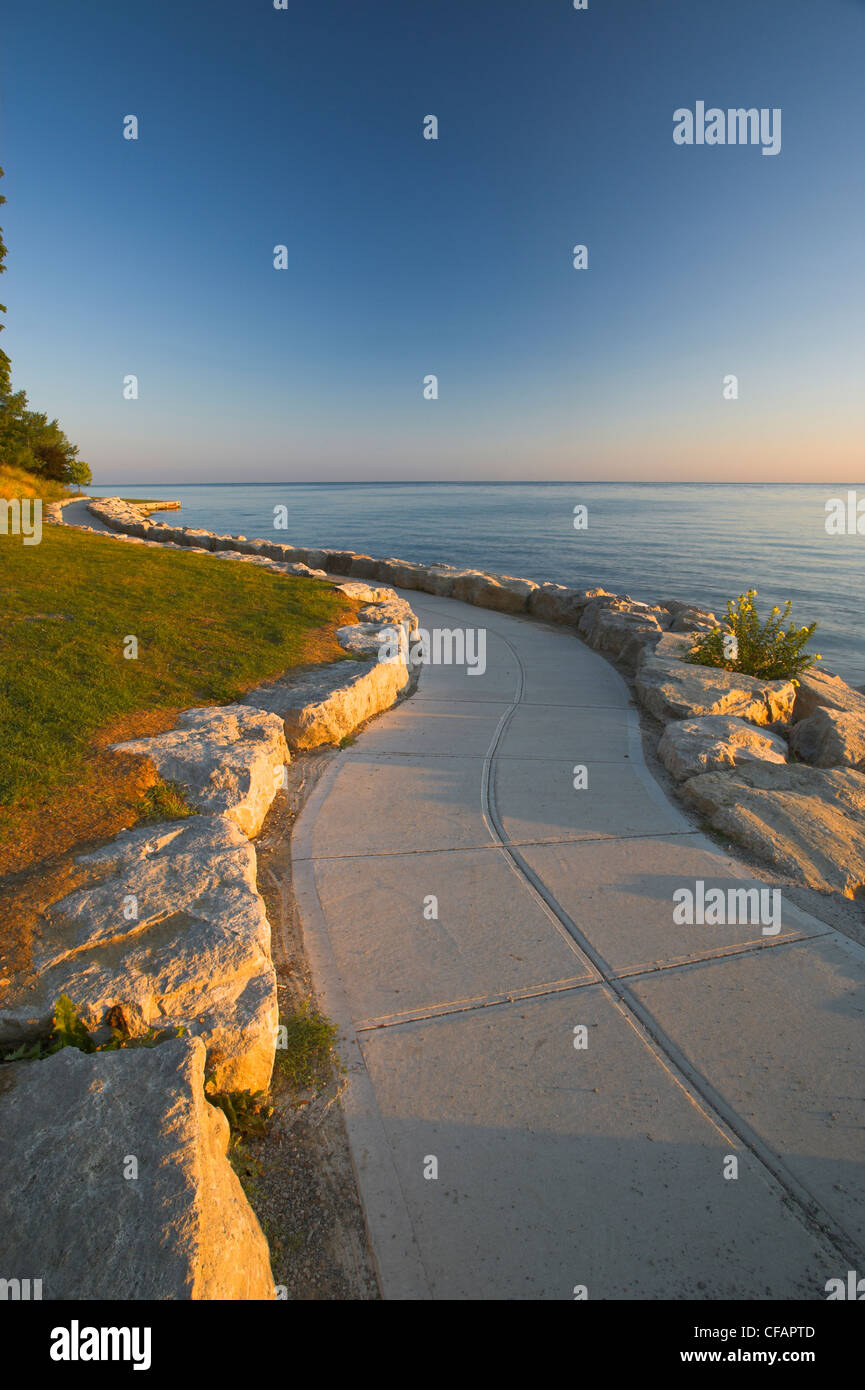 Stone path along the shore of Lake Ontario at sunrise, Niagara-on-the-Lake, Ontario, Canada Stock Photo