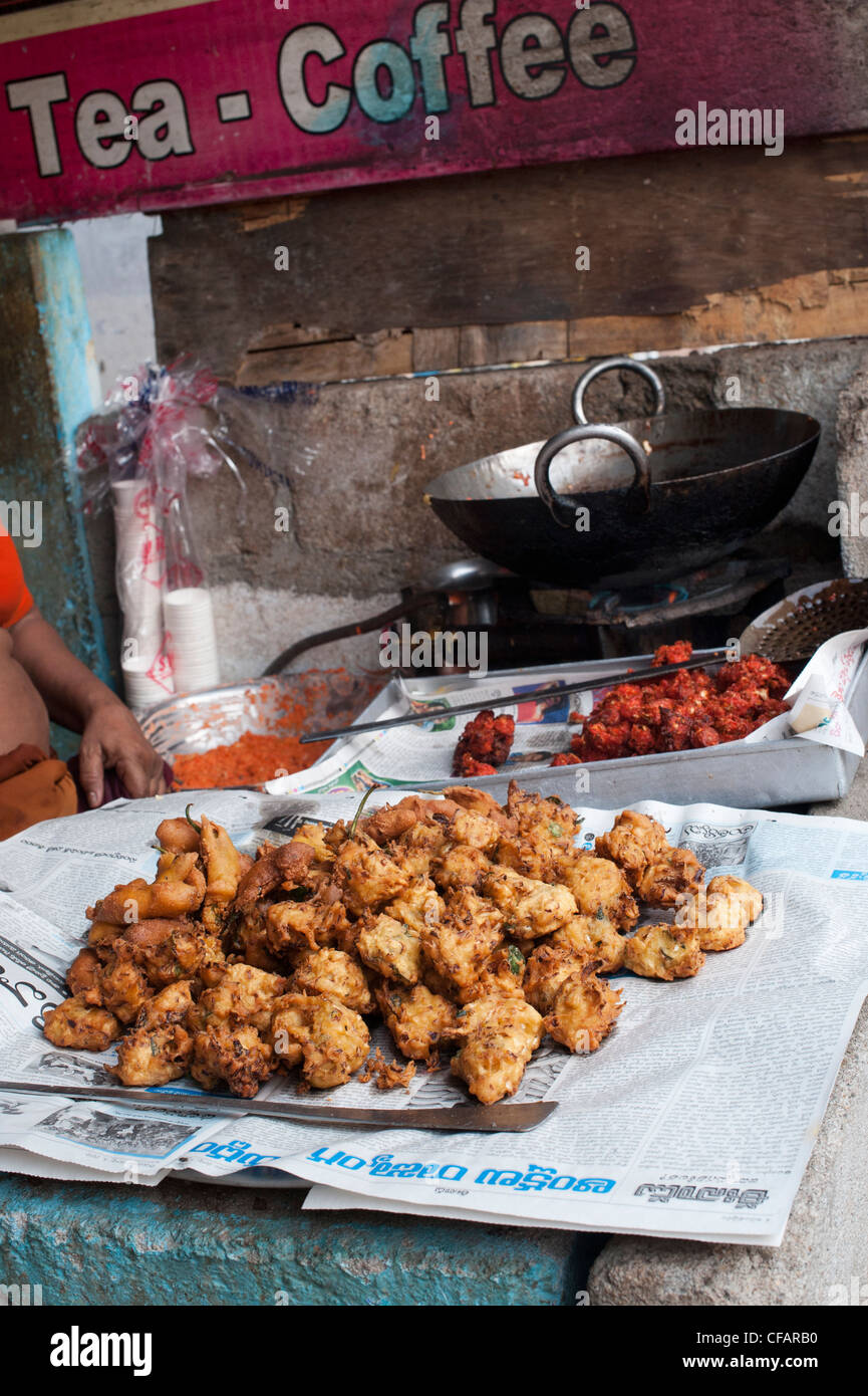 Deep fried indian street food for sale in a dirty indian street cafe. Andhra Pradesh, India Stock Photo
