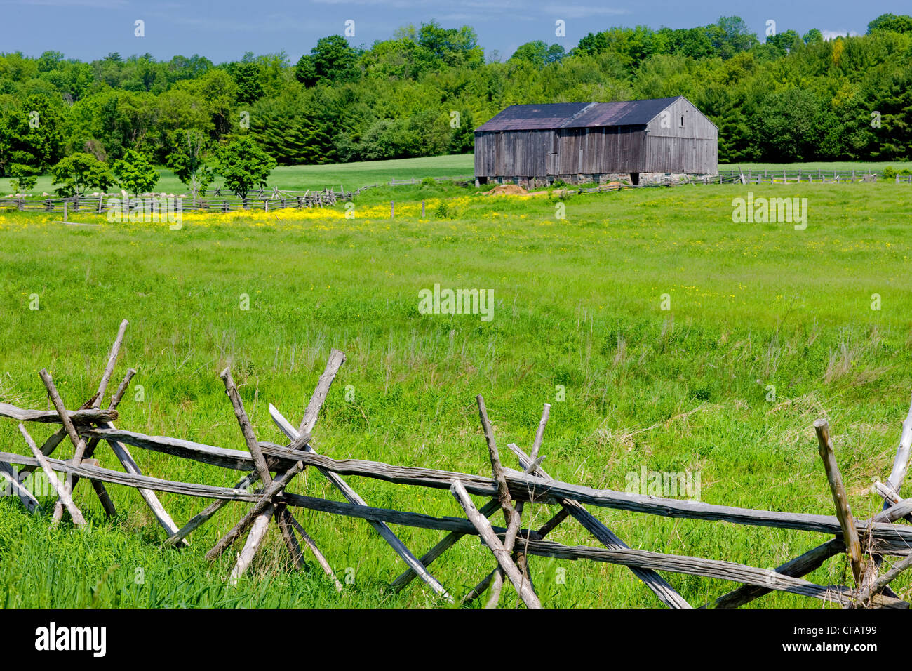 Old fence and barn, Warkworth, Ontario, Canada. Stock Photo