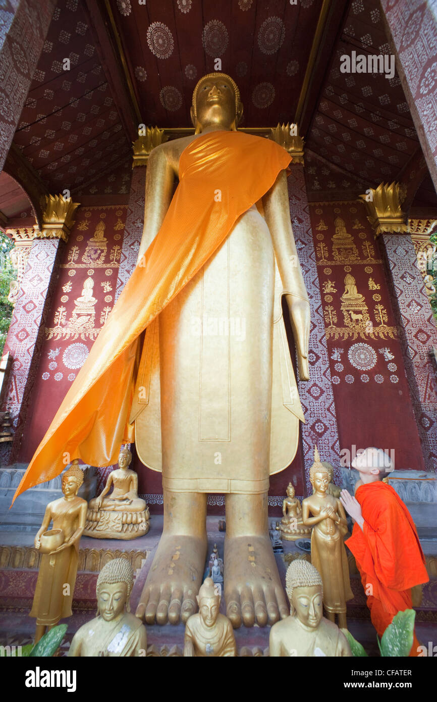 Laos, Luang Prabang, Wat Sensoukarahm, Giant Standing Buddha Statue Stock Photo