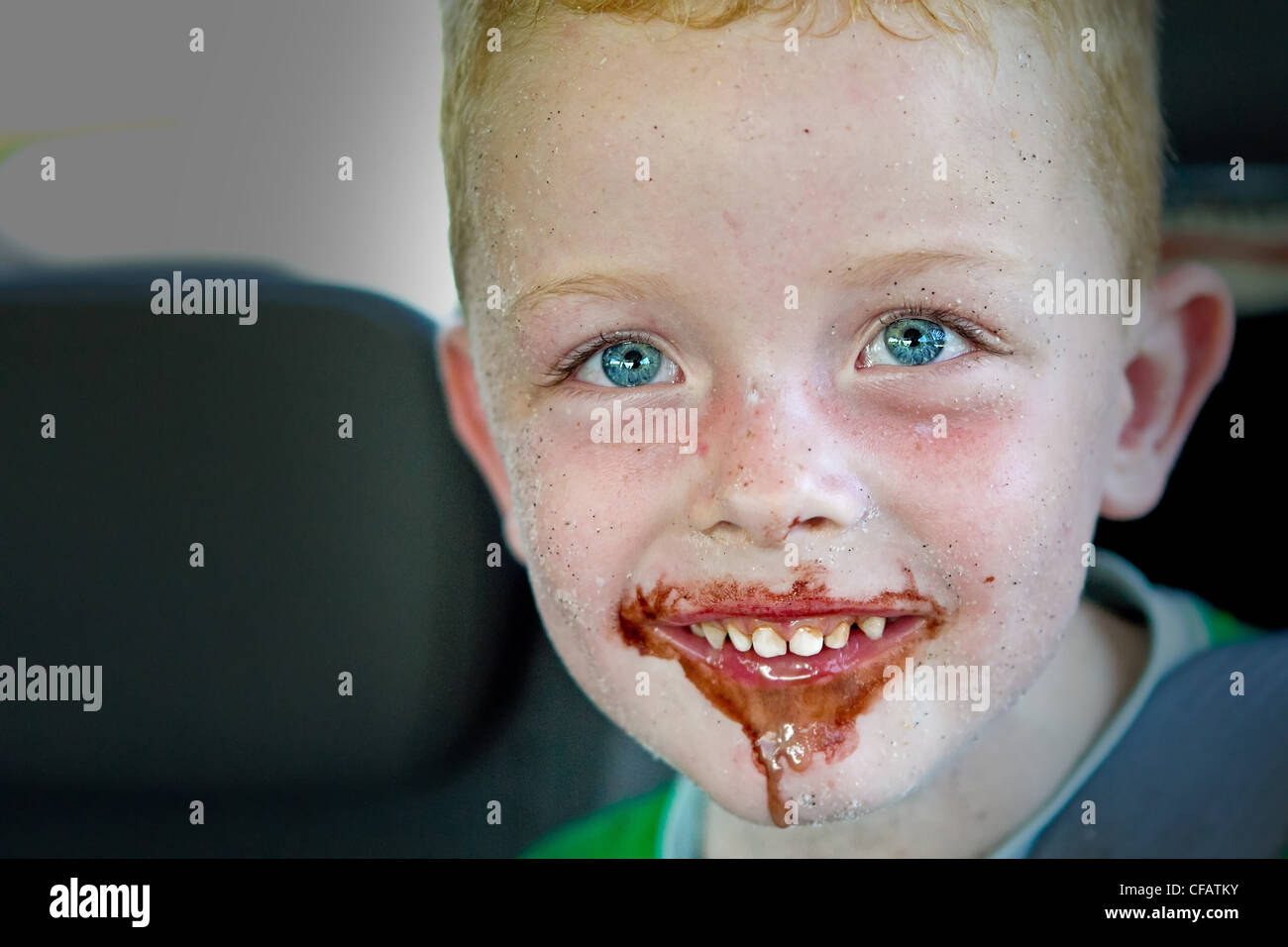 little boy eating a chocolate ice cream Stock Photo Alamy